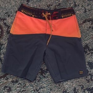 Billabong kids Orange and Black Swim Shorts size 23